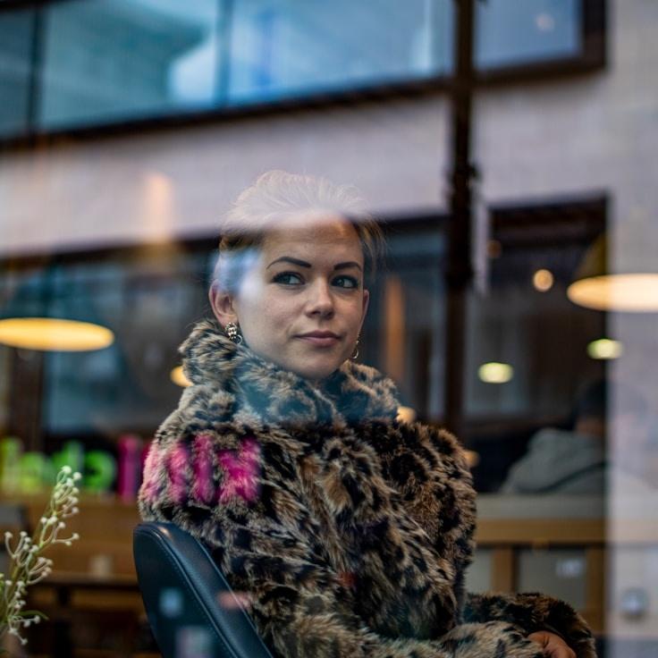 Kaveri Mehta, Lead Design Curator at Maple Canvas Node, reviewing corporate floral arrangements